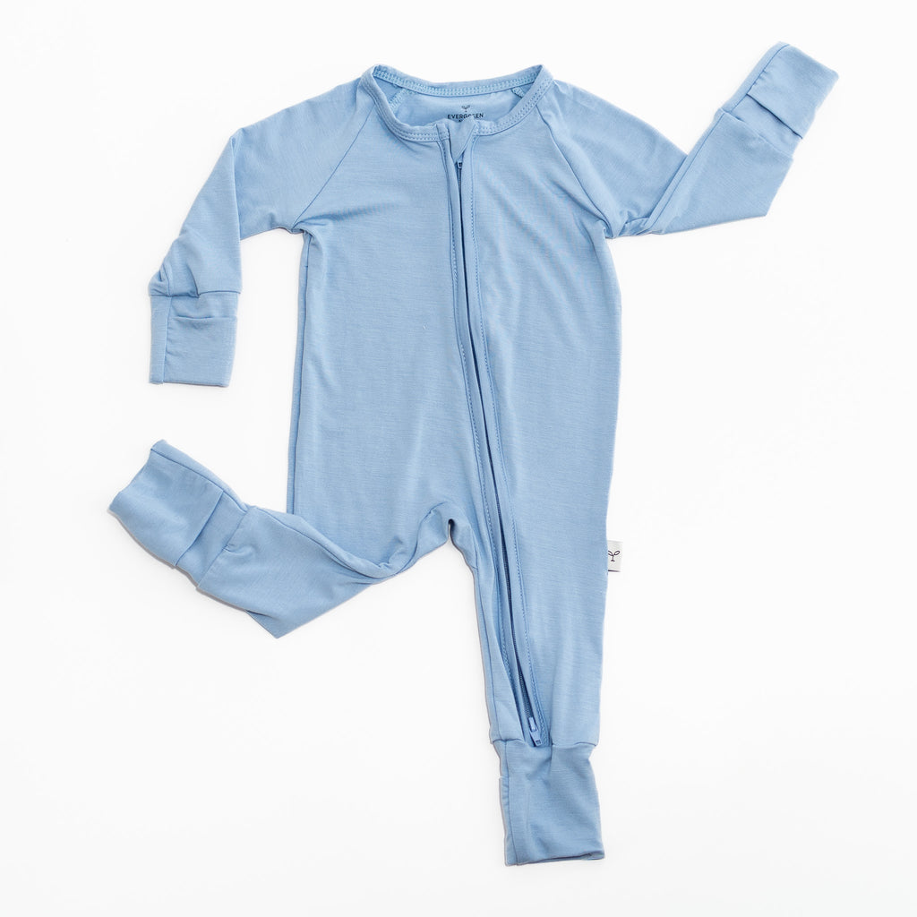 Light blue baby romper bamboo with zipper on a white background.