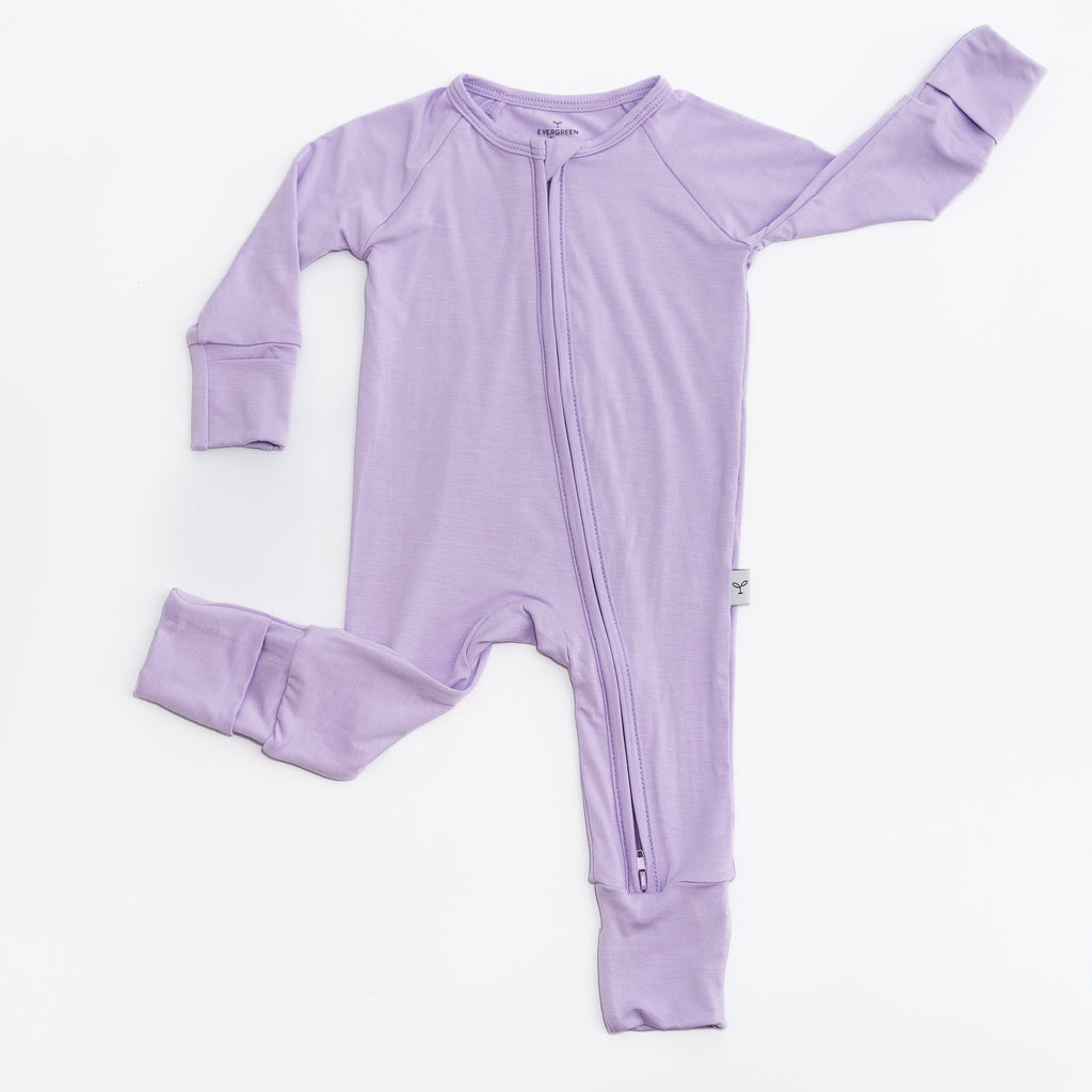 Purple baby romper bamboo with a zipper on a white background.
